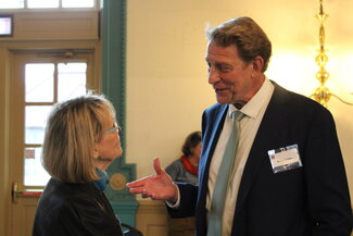 A man talking to a woman