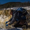 Dr. Bruce Fouke sampling water at Yellowstone National Park