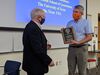 Dr. Sharp is presented with his award