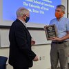 Dr. Sharp is presented with his award